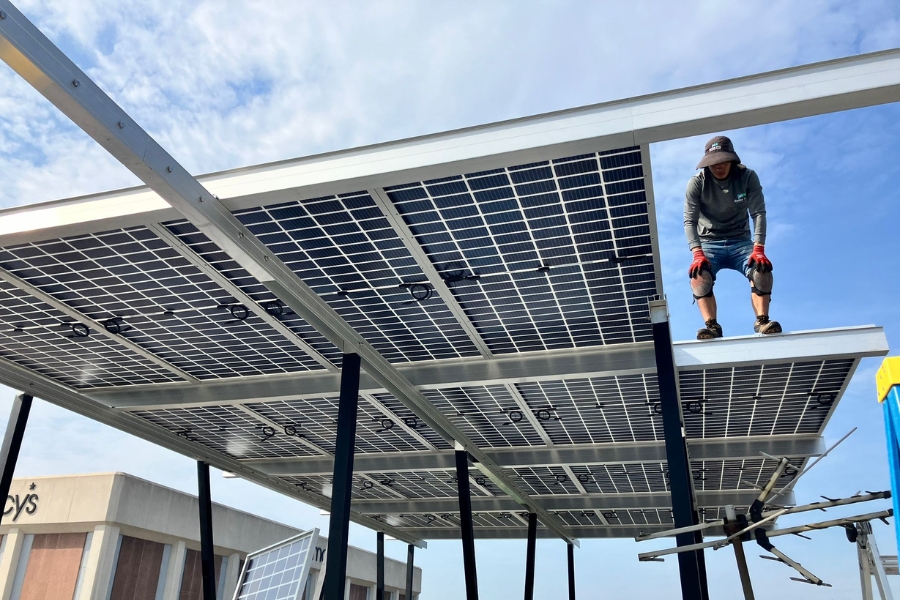 solar panel installer on commercial rooftop