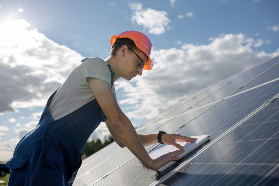 person installing solar panels
