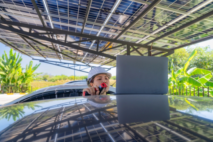 solar installer in new york city fixing solar panel shelter